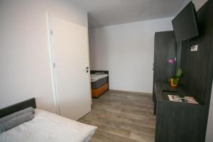 Postel nebo postele na pokoji v ubytování Apartments A7