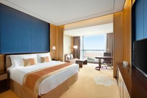 Voodi või voodid majutusasutuse Ramada Foshan Nanhai toas
