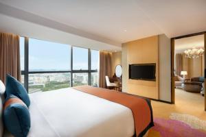 Voodi või voodid majutusasutuse Ramada Foshan Nanhai toas