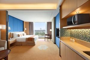 Voodi või voodid majutusasutuse Ramada Foshan Nanhai toas