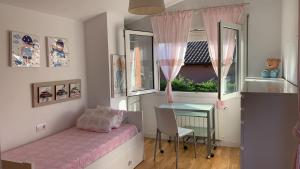 Postel nebo postele na pokoji v ubytování Nice Home + 5 fotografií