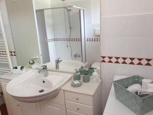 a white bathroom with a sink and a mirror at Rocca di Corno Guest House in Finale Ligure +66 photos