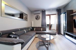 a living room with a couch and a table at Villa Mariella in Novalja