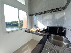 Kuchyň nebo kuchyňský kout v ubytování Pure Laguna Residence by Nice Sea Resort