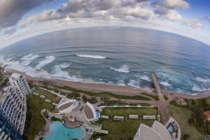 an aerial view of the beach and the ocean at Pearls of Umhlanga Apts in Durban