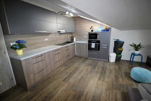 A kitchen or kitchenette at Shiny Star Apartmán