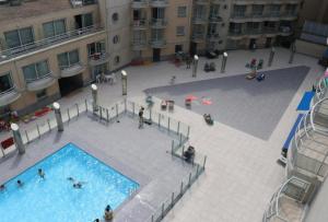 an overhead view of a swimming pool in a building at Appartement "Zeezicht 002" in Ostend