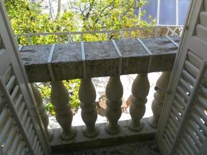 a balcony with a table on a porch at Apartments David in Perast
