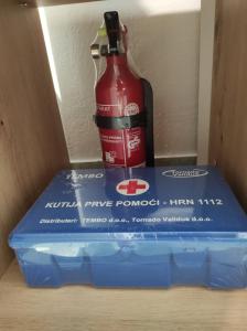 a bottle of ketchup sitting on top of a box at Romantic Apartment Sonja, Beachfront in Cesarica