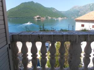 a view of a lake from a balcony at Apartments David in Perast