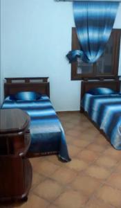 Postel nebo postele na pokoji v ubytování Cabo Negro-Les Jardins de Cabo Negro