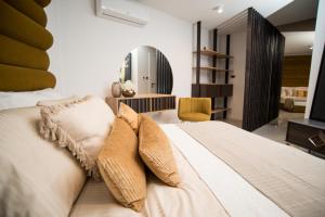 a bedroom with a bed with two pillows on it at LUXURY apartment ROYAL IRIS in Njivice +45 photos
