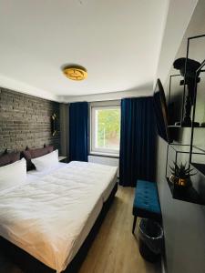 Postel nebo postele na pokoji v ubytování IQ Hotel Hannover