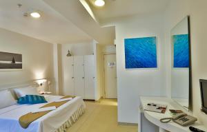 Postel nebo postele na pokoji v ubytování Han Hotel + 37 fotografií