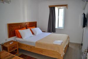 Postel nebo postele na pokoji v ubytování merih butik hotel
