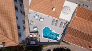 an overhead view of a building with a swimming pool at Eressian Hotel & Hammam Spa in Eresos