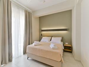 Posteľ alebo postele v izbe v ubytovaní KaSta Family Apartments