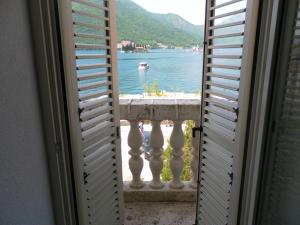 a view of a lake from a window at Apartments David in Perast