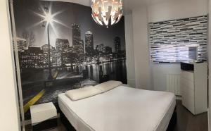 A bed or beds in a room at Tunel10