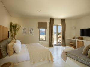 Posteľ alebo postele v izbe v ubytovaní White Pebble Suites
