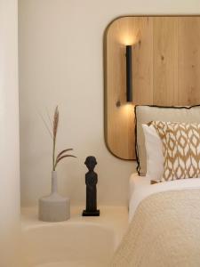 Posteľ alebo postele v izbe v ubytovaní White Pebble Suites