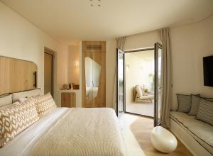 Posteľ alebo postele v izbe v ubytovaní White Pebble Suites