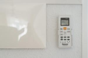 a calculator is attached to a wall at Villas New Lanzasuites in Playa Blanca +35 photos