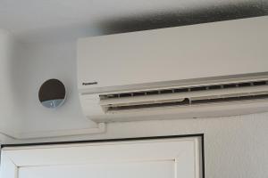 a vent over a white door in a room at Villas New Lanzasuites in Playa Blanca