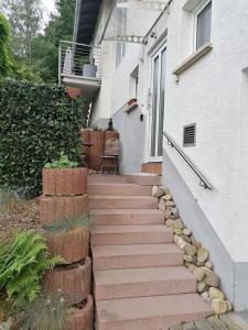 a set of stairs leading to a house at Ferienwohnung Roder in Marburg an der Lahn
