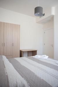 Postel nebo postele na pokoji v ubytování Residence Tenuta Masiedd 1