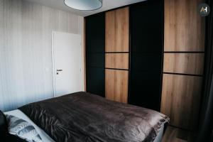 Posteľ alebo postele v izbe v ubytovaní AH Nová Terasa I