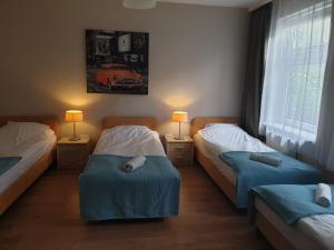 Posteľ alebo postele v izbe v ubytovaní blatoapartament
