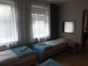 Posteľ alebo postele v izbe v ubytovaní blatoapartament