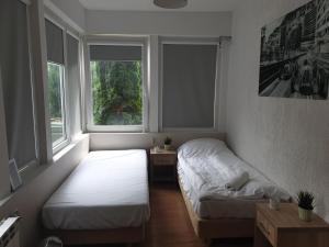 Posteľ alebo postele v izbe v ubytovaní blatoapartament
