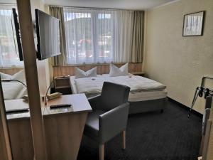 Rúm í herbergi á Rügen-Hotel