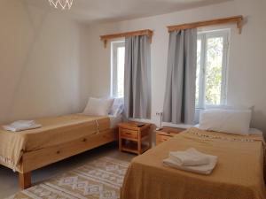 Postel nebo postele na pokoji v ubytování merih butik hotel