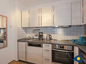 Kuchyň nebo kuchyňský kout v ubytování Villa Maria Gabriele Whg 13