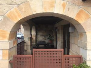an archway in a building with a table in it at Casa el Elefante Blanco in Cabarceno