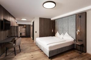 Posteľ alebo postele v izbe v ubytovaní Hotel Das Kohlmais