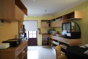 A cozinha ou kitchenette de Hospedaria Robalo