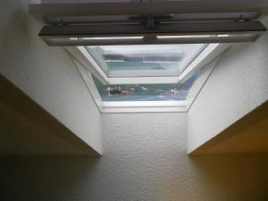 a ceiling with a skylight in a room at Apartments David in Perast