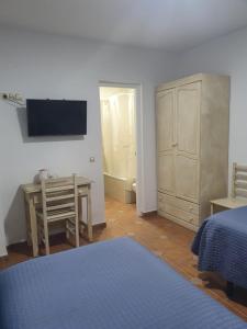 Postel nebo postele na pokoji v ubytování Hostal Canalejas