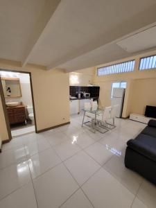 a living room with a couch and a table at Hello Guyane - F2, Nº4 Haut Standing et Mezzanine in Cayenne +19 photos