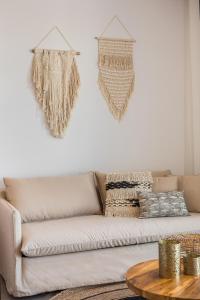 a living room with a couch and a table at Amyth of Mykonos Super Paradise in Super Paradise Beach