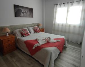 A bed or beds in a room at ApartaSol