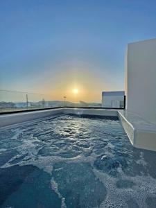 a swimming pool on the roof of a house at Mazera Boutique Hotel in Mikonos