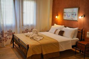 Postel nebo postele na pokoji v ubytování Hotel Petradi