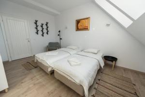 Postel nebo postele na pokoji v ubytování Casa Botár Vendégház