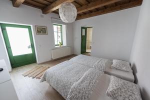Postel nebo postele na pokoji v ubytování Casa Botár Vendégház