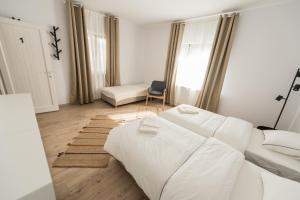 Postel nebo postele na pokoji v ubytování Casa Botár Vendégház